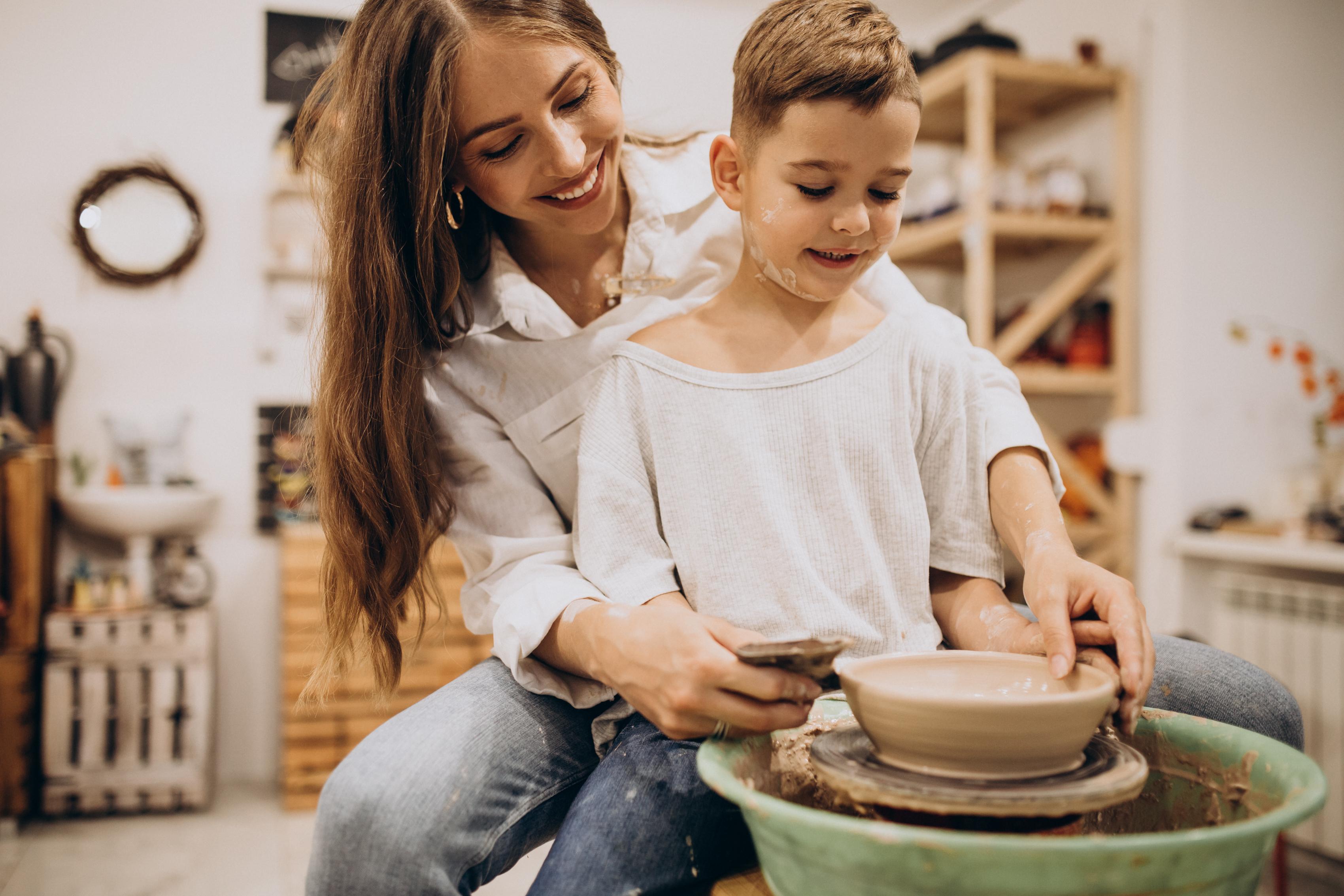 Mother with son at a pottery class